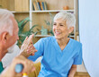 © Lumos sp - Doctor or nurse caregiver woman with senior man giving high five at home or nursing home