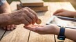 © Thumbs - Elderly hand giving coin to younger hand with smartwatch and tablet