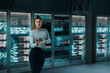 © Rendara Studio - Woman technician supervising servers in digital 3D data center