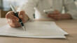 © sebra - The businesswoman is reviewing the documents