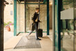© Boris Jovanovic/Stocksy - Man arrives at the hotel