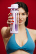 © wedmoments.stock - Fitness lifestyle concept with athletic woman holding water bottle on isolated background.