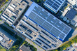 © Yic Ma/Stocksy - Solar panels on office building rooftop
