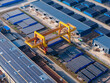 © Yic Ma/Stocksy - Aerial steel pipe warehouse with gantry crane