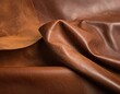 © almarkha - Close-up of rich brown, textured leather with elegant folds