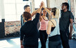 © Hinrichsen/peopleimages.com - High five, fitness and group of friends in gym with workout, wellness and training with goal success. Hands together, achievement and athletes with exercise for health or challenge in sports center.