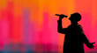 © aboutnuylove - Silhouette of a man singing with a microphone on colorful background