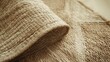 © MUHAMMAD - Close up view of a natural woven jute rug showing its detailed texture and organic fiber construction