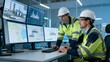 © Gianna - Two engineers working on industrial control systems