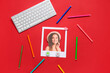 © Pixel-Shot - Photo of beautiful woman with computer keyboard and markers on red background. Concept of online dating
