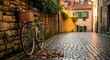 © S.Creative - A vintage bicycle parked on a cobblestone alleyway in a quaint european town with historic buildings
