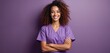 © miss irine - Young happy nurse in purple scrubs arms crossed against violet background. Smiling woman works in healthcare medicine clinic. Professional medical staff pose for portrait.