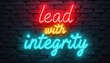 © Vadym - Neon text reads lead with integrity on brick wall. Positive message conveys honesty ethical principles. Ideal for business leadership or personal growth.