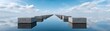 © Adul khotchasri - A surreal scene of stone blocks forming a path across a perfectly reflective water surface under a partly cloudy blue sky.