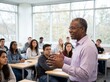 © Meow Creations - Smiling african american male educator teaching a lesson to a group of attentive college students