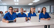 © Andrey Popov - Medical Students In Lecture Hall Using Laptops