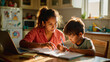 © Nataliia S. - Mother teaching son at home with laptop during homeschool lesson. Concept of work from home parenting, elementary education support, and authentic domestic learning.
