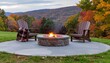 © Seasonal Holiday - Firepit and Adirondack Chairs. Fall Foliage in Rural Countryside. Around dusk of a stone firepit already lit, with two comfortable wooden Adirondack chairs facing the view of the colored forest.