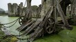 © AkmalRunaidi - Ancient Wooden Drawbridge Mechanism at Castle Ruins