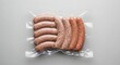 © Donny - Variety of raw sausages in vacuum packaging against a neutral background
