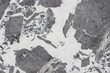 © Muhammad - Invisible Grey marble texture with large dark grey brecciated patterns on a crystal white base.
