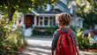© Laura - Smiling young boy with red backpack walking down sunny street towards house in distance, cheerful school journey, residential walk scene, faceless child walking, defocused street