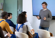 © JackF - Teacher making presentation for students using digital board