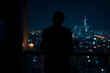 © Borneo - Silhouette of Person Overlooking Night City Skyline with Candlelight