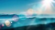 © Alexei - Blurred landscape of distant mountains under a bright sun with soft lens flares creating a serene atmosphere in a natural setting
