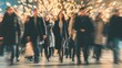 © irawan - Blurred motion of a crowd of people walking in a busy city street at night, creating a dynamic and energetic urban scene.