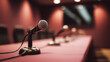 © Maksim Shebeko - Several microphones line a sleek conference table, inviting speakers for a significant press event Generative AI