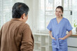 © Ekkasit A Siam - Senior asian woman preparing for movement as young asian female physiotherapist stands nearby during home rehabilitation reflecting calm support and trust in elderly therapy session