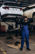 © Roman - Mechanic working on car in repair shop
