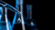 © dreamdes - Blue liquid droplet from a pipette on a dark background. Scientific research and medical innovation in a laboratory setting for pharmacy development