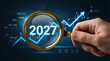 © Neo GT - Magnifying Glass Highlighting “2027” Over Rising Financial Graph Symbolizing Future Investment Opportunities