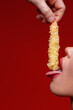 © Анатолій Патрашок - Man puts shrimp tempura in sexy girl's mouth. Sexy food