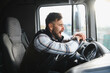 © Serhii - Tired truck driver yawning feeling fatigue while driving