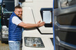 © Serhii - Happy truck driver hugging his new freight vehicle