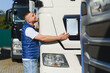 © Serhii - Truck driver inspecting vehicle for logistics and transport