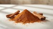 © NeuralNiche - Heap of cinnamon powder with whole cinnamon sticks arranged neatly