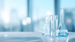 © Favio - Medical laboratory glassware including test tubes and flasks made of clear glass with transparent liquid on clean clinical background with copy space.