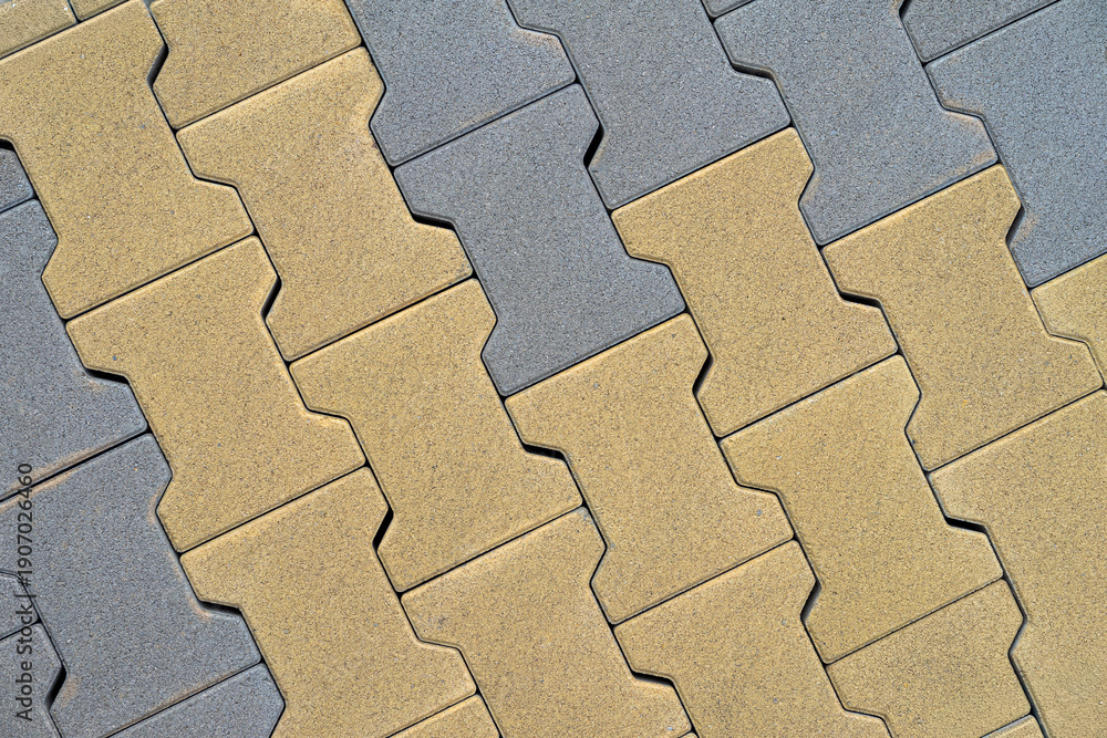 Concrete paving blocks arranged in repeating zigzag pattern with ...