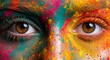 © Budi - Panoramic close up of intense female eyes surrounded by vibrant rainbow Holi colors showing artistic makeup texture, human expression, and detailed cultural festival photography style.