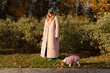 © Asya Molochkova/Stocksy - Autumn Walk with Curious Puppy in Jacket