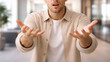 © mailcaroline - a man gesturing with open hands, conveying confusion, frustration, or a plea for an answer or explanation