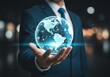 © lisha - Businessman holding illuminated globe with network connections in his hand elegantly posed