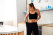 © WellStock - Woman Shows Off Weight Loss Success
