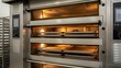 © skdesign - Industrial steel baking oven with multiple racks operates in a commercial kitchen
