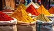 © REGINA - Vibrant piles of various spices in burlap sacks on a market stall with warm tones and a bustling atmosphere.