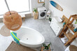 © Pixel-Shot - Interior of light bathroom with bathtub, washing machine, big window and surfboard